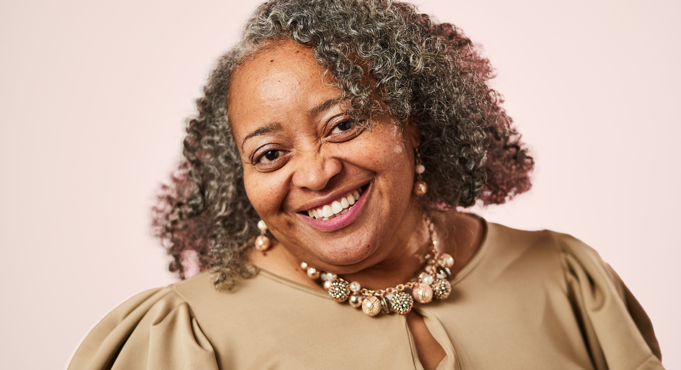 Headshot image of breast cancer survivor and Gateway to Hope recipient named Minette.